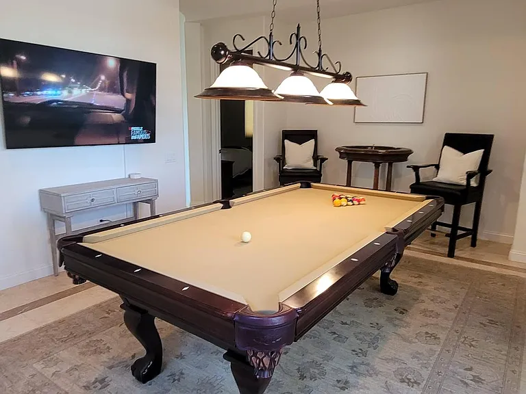 Large play area with pool table, roulette table, large TV