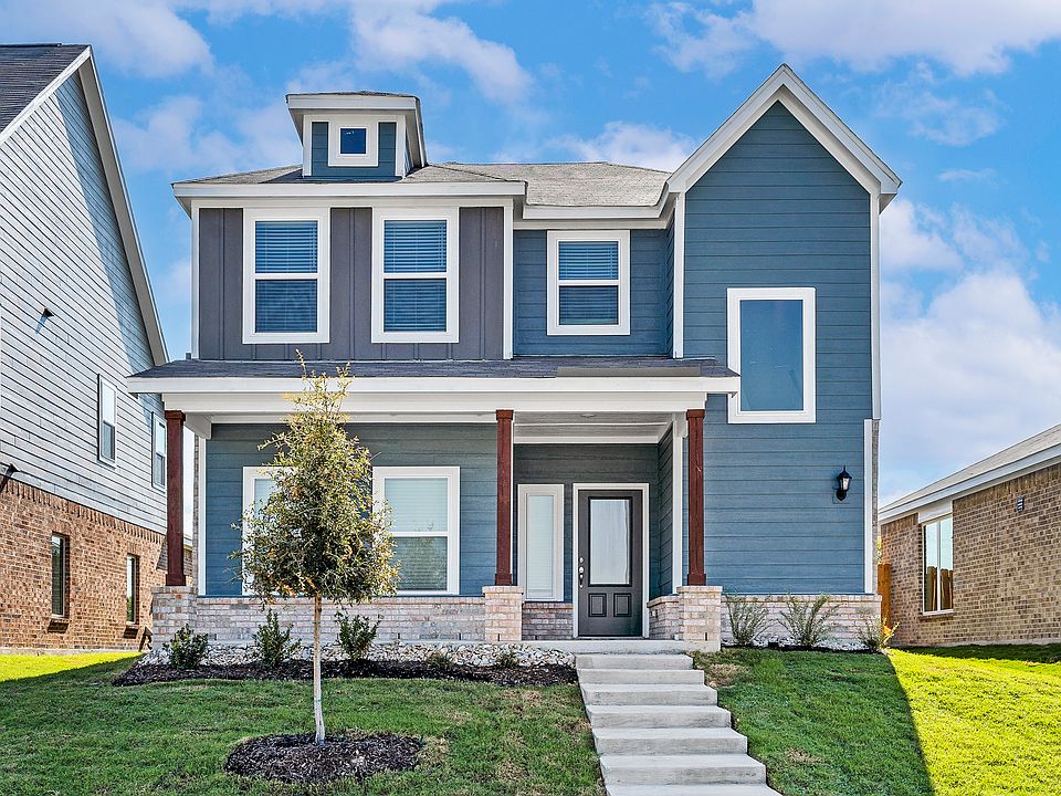 The Azakea is a beautiful two-story home with a siding exterior and brick accents.