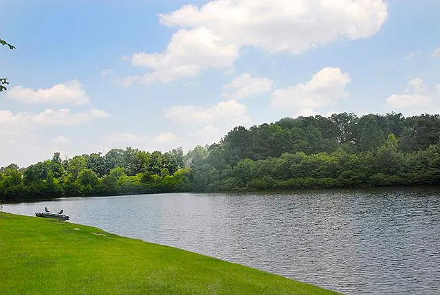 Village Lakes has 4 miniature lakes for kayaking, boating, and fishing. View of lake behind home.