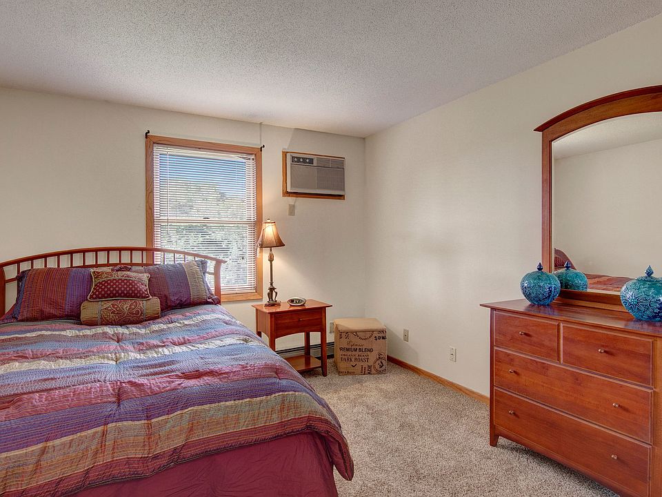 Town Centre Bedroom View with Bed and Mirror