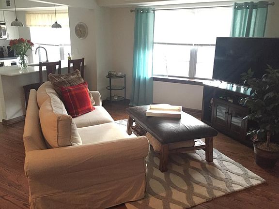 Cozy living room with natural lighting during the day and co