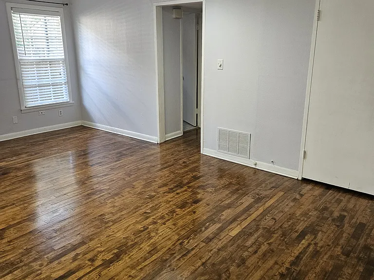 From kitchen to living room and hall to bedrooms and bath. Living room has two storage closets.