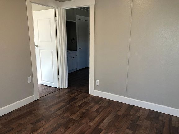 Living room (right doorway to kitchen, left doorway to bedroom)