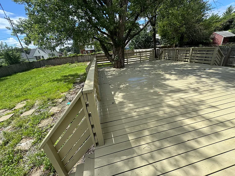 Huge, tree-shaded backyard deck!