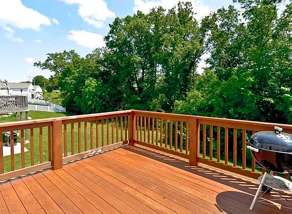 Relax on this freshly stained deck that backs to private wooded grounds