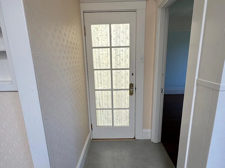 to downstairs and back bedroom