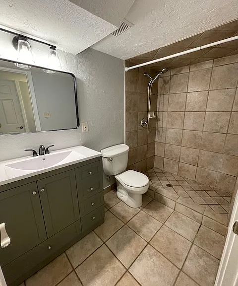Newly remodeled bathroom with shower and new vanity.