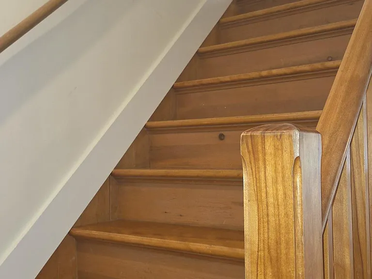 Stairway Leading To Second Floor Bedrooms And Bathroom With Laundry