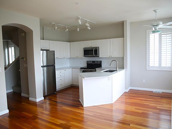 Open kitchen with stainless-steel appliances