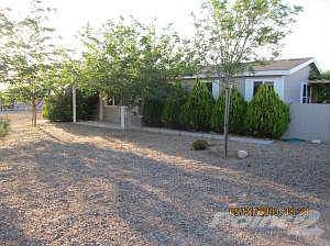 FRONT OF THE HOME/ LANDSCAPED/ TREES