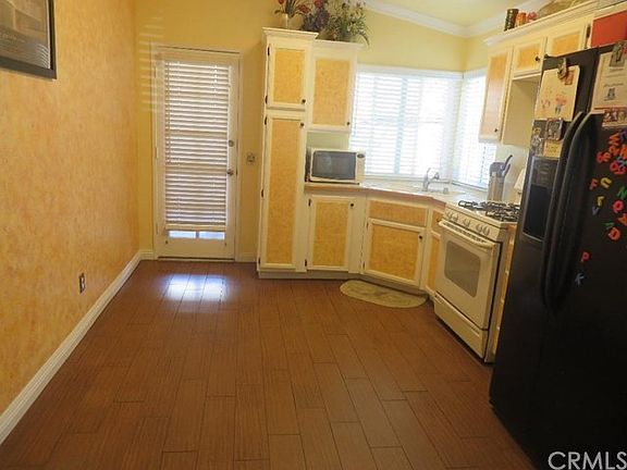 Kitchen view with door to back patio