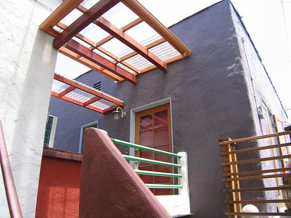 Covered bridge connection between main house and carriage house