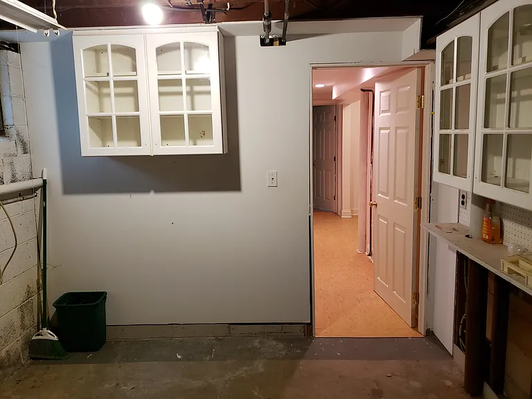 Basement workshop (wall cabinet was on shared bathroom wall was removed since this photo was taken).