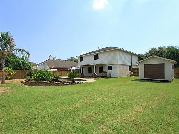 After taking a splash in the refreshing pool, you'll enjoy a huge back yard with a lush lawn for more outdoor enjoyment!