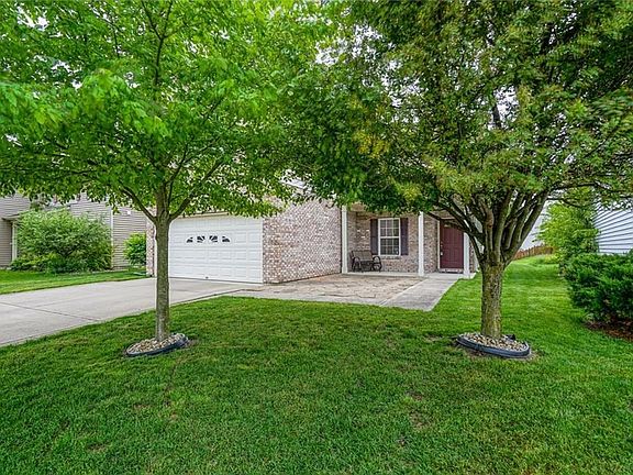 Nice patio area, front porch and mature trees!