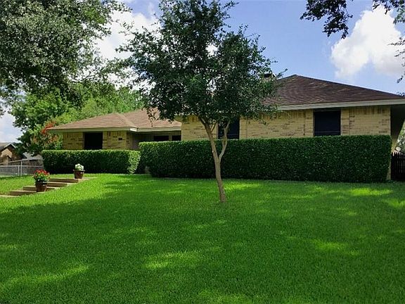 Lush lawn and pretty landscaping