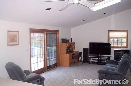 Family Room / Den : Pella 8-ft wide sliding door leads to large, low-maint Timbertech deck; skylite.