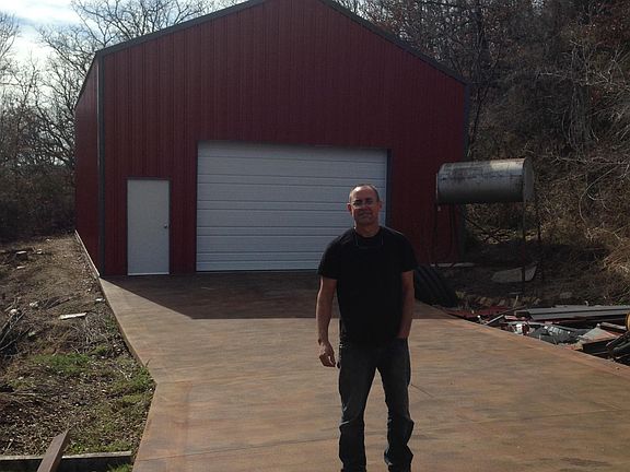 At the top of the private driveway, 30 x 50 Metal Building/Shop is to the left. Fully electric (both 110v & 220v) with LED overhead lights, automatic extra tall overhead door & loft for even more storage. Fabulous space. There is another 2 car pad to the