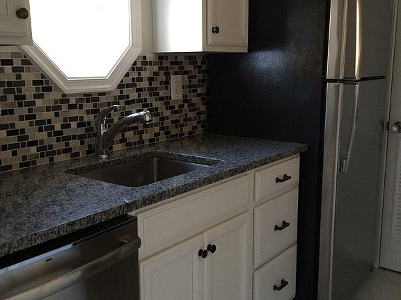 Kitchen with window. Stainless steel appliances