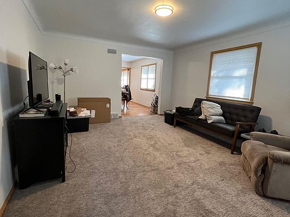 Living room with new carpet installed in 2022.