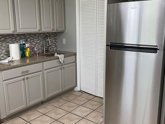 Stainless steel Refrigerator, laundry area and sink