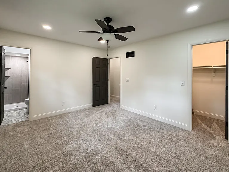 Primary Bedroom with 3/4 Bath and Walk In Closet