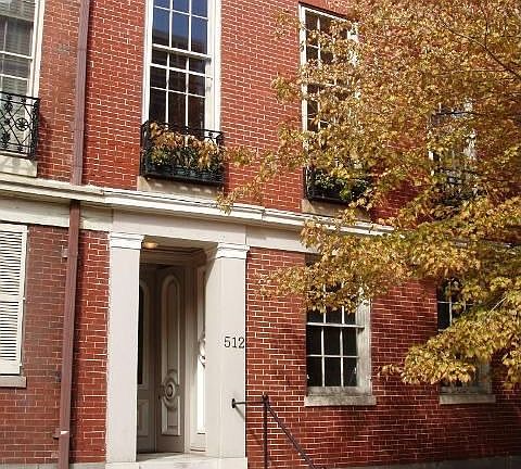 2nd-floor unit has 3 iron balconies for flowerboxes