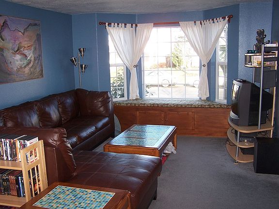 Living room - window seat is custom made. Can be removed, not attached.