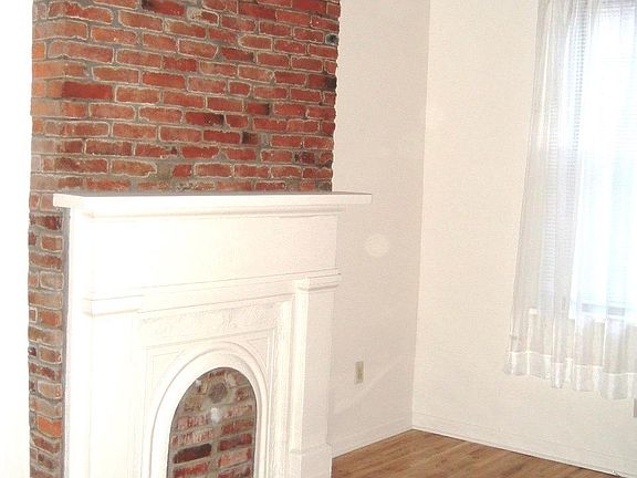 Original Brick wall above mantle in Lvrm