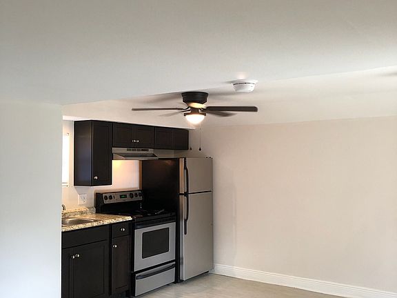 View from the bedroom into the kitchen and dining area.