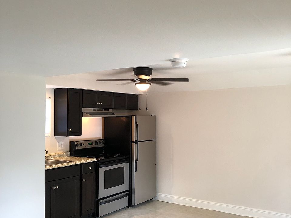 View from the bedroom into the kitchen and dining area.