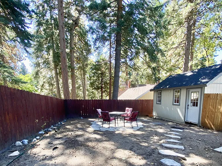 Backyard with separate bedroom/shed/studio and private fenced flat yard.