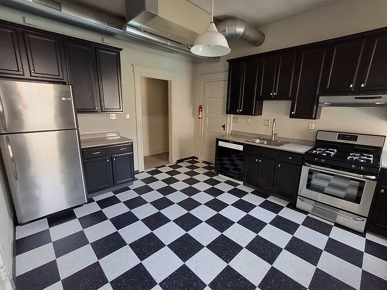 The kitchen is large enough to have a table.
