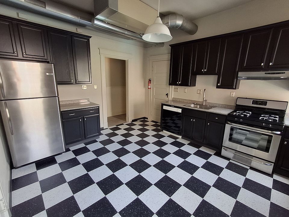 The kitchen is large enough to have a table.