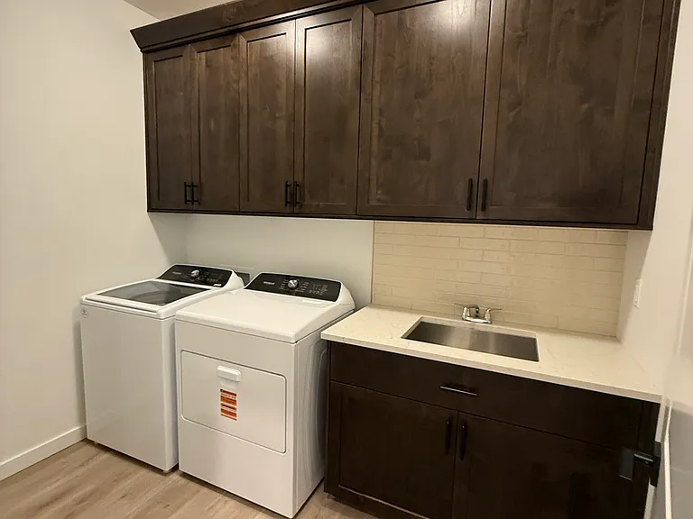 Laundry w/ built ins & sink, W/D included.