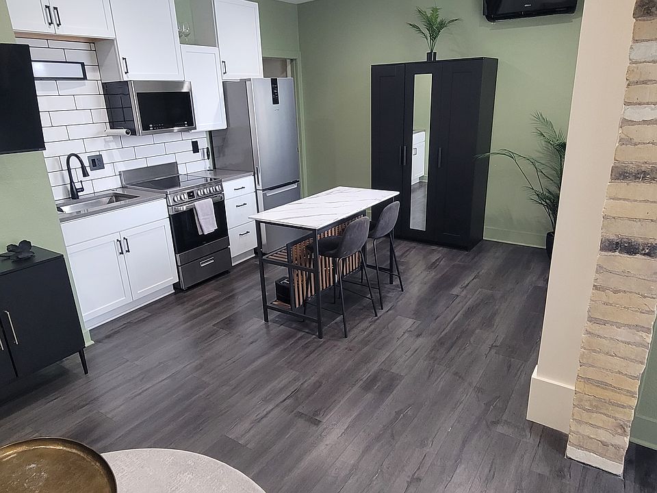 Studio kitchenette. Microwave, stove and refrigerator. Small appliances included, toaster, coffeemaker.