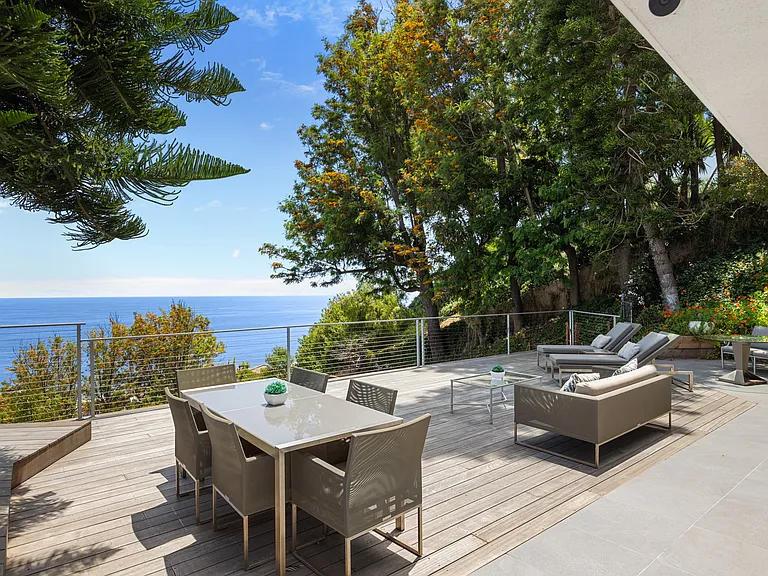 Enjoy additional private dining and outdoor lounge space directly accessible from the bedroom.
