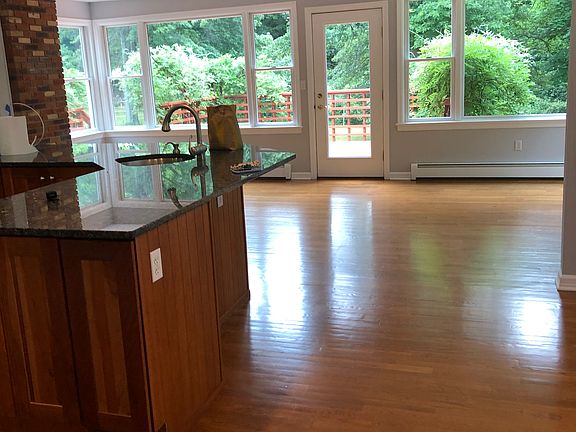 Kitchen with breakfast area and room that opens to deck.