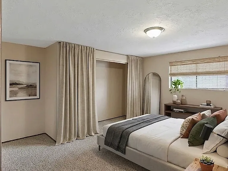 Large primary bedroom fits king sized set
