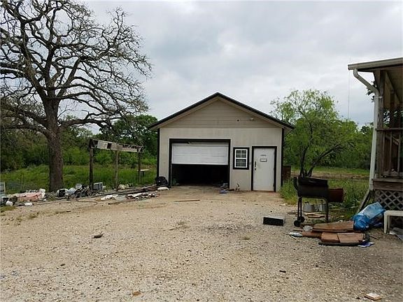 Detached garage to left of the house.