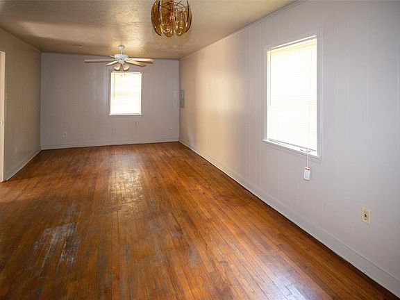 den and dining combo with wood floors