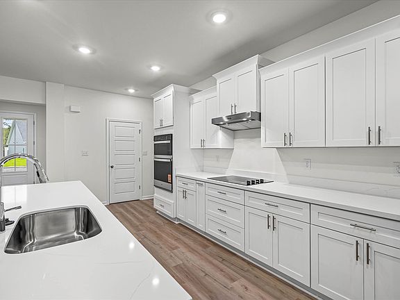 Kitchen in the Brooks floorplan at a Meritage Homes community in Gulfport, MS.