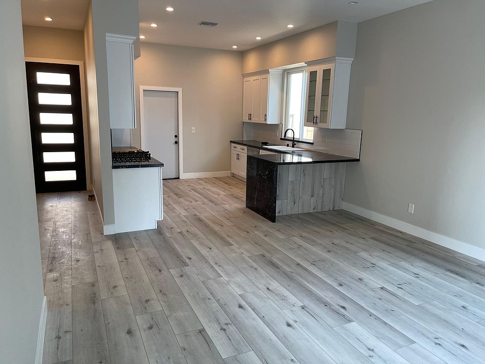 Open floor plan with entry into kitchen from garage