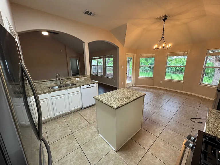 Kitchen overlooking breakfast area and living room