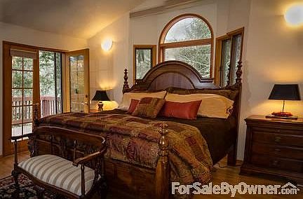 Master Bedroom
						:
						Doors to exterior private deck. Large windows look to trees.