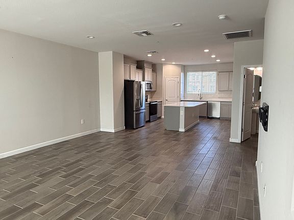 Great room attached to kitchen.