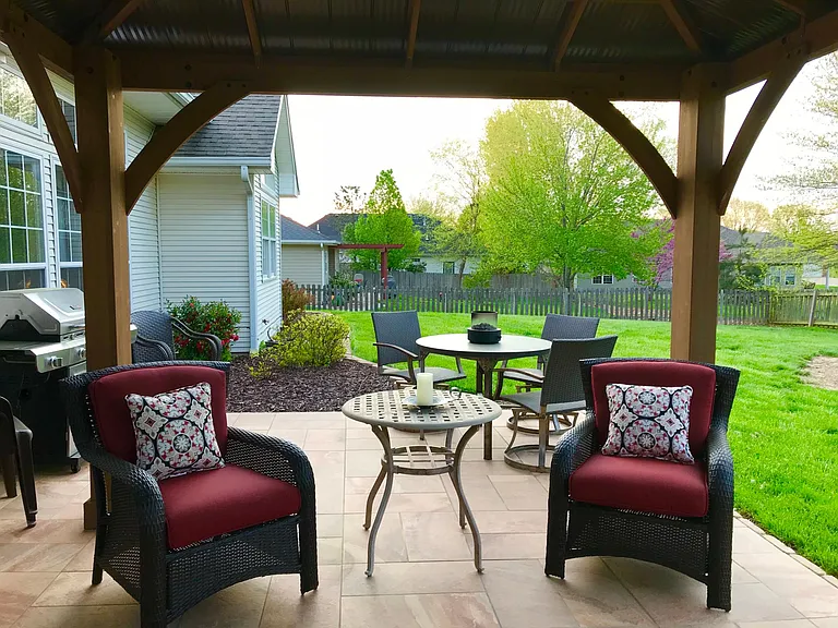 Tile patio with new gas grill & big backyard