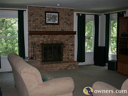 large family room and woodburning fireplace