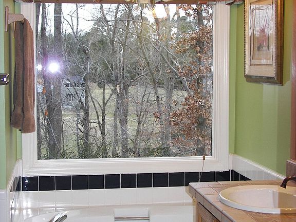 The owners bath has a garden tub, separate shower and breathtaking view.