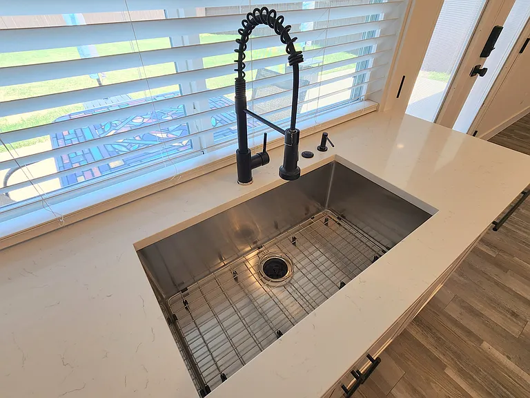 deep sink with quiet disposal, deck-mounted soap dispenser